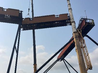 Conveyor section being lifted out by mobile crane